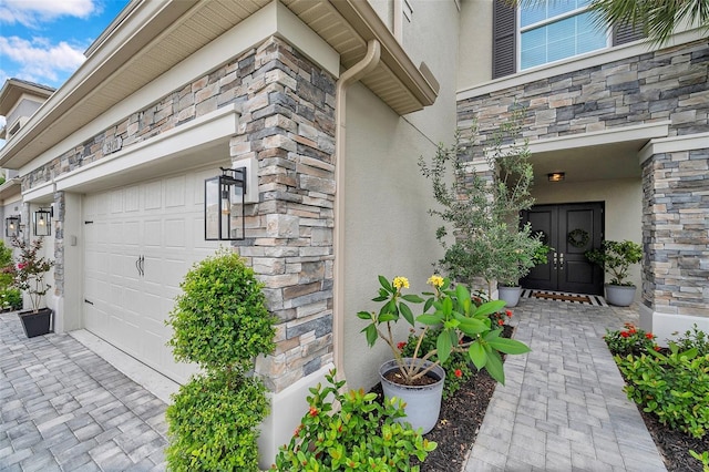 32490 Tree Of Life Ave, Wesley Chapel, FL 33543 - entrance to property featuring stucco siding, stone siding, and french doors