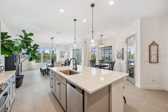 32490 Tree Of Life Ave, Wesley Chapel, FL 33543 - kitchen with a sink, dishwasher, light countertops, light tile patterned flooring, and gray cabinets