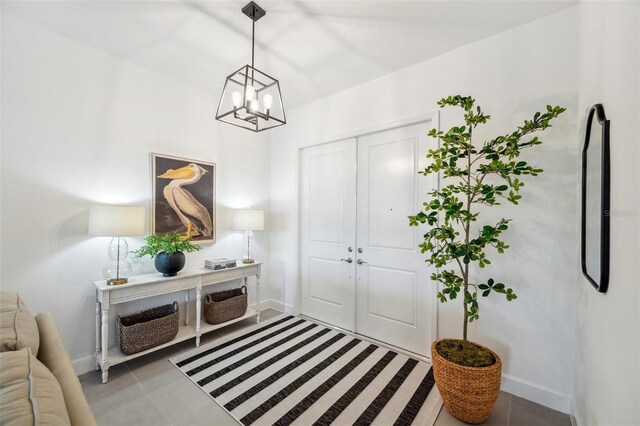 32490 Tree Of Life Ave, Wesley Chapel, FL 33543 - entrance foyer featuring a chandelier, baseboards, and tile patterned floors