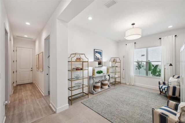 32490 Tree Of Life Ave, Wesley Chapel, FL 33543 - living area featuring baseboards and recessed lighting