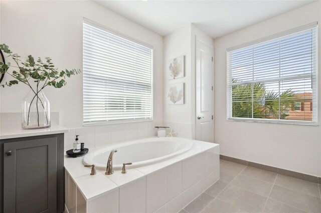 32490 Tree Of Life Ave, Wesley Chapel, FL 33543 - full bath featuring a bath, plenty of natural light, and tile patterned floors