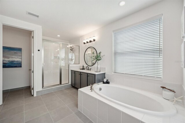 32490 Tree Of Life Ave, Wesley Chapel, FL 33543 - full bathroom with a shower stall, vanity, a bath, tile patterned floors, and recessed lighting