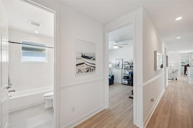 32490 Tree Of Life Ave, Wesley Chapel, FL 33543 - hall featuring light wood finished floors, baseboards, and recessed lighting