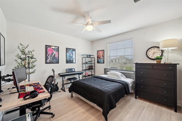 32490 Tree Of Life Ave, Wesley Chapel, FL 33543 - bedroom featuring light wood-style flooring, a desk, and ceiling fan