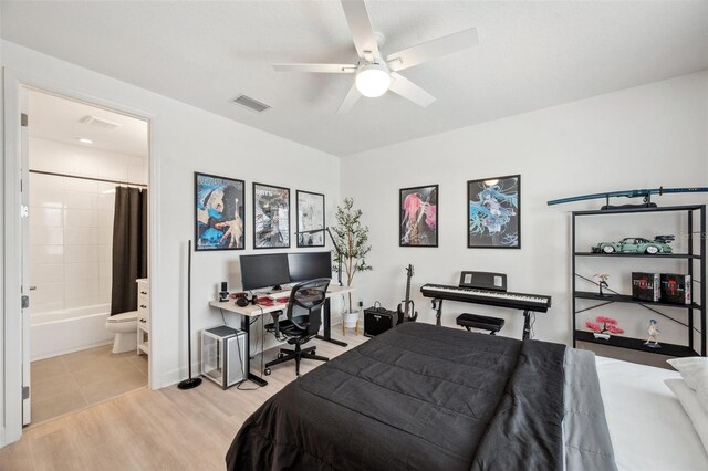32490 Tree Of Life Ave, Wesley Chapel, FL 33543 - bedroom featuring light wood finished floors, a desk, connected bathroom, and ceiling fan