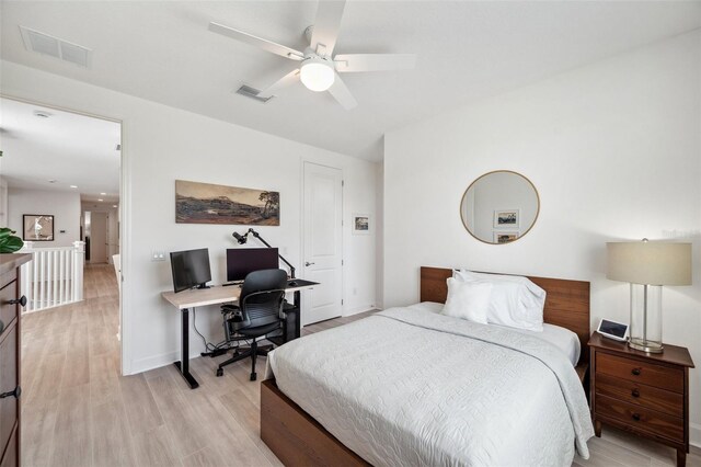 32490 Tree Of Life Ave, Wesley Chapel, FL 33543 - bedroom featuring a desk, light wood-type flooring, baseboards, and a ceiling fan