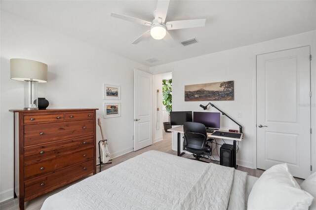 32490 Tree Of Life Ave, Wesley Chapel, FL 33543 - bedroom featuring baseboards, wood finished floors, and a ceiling fan