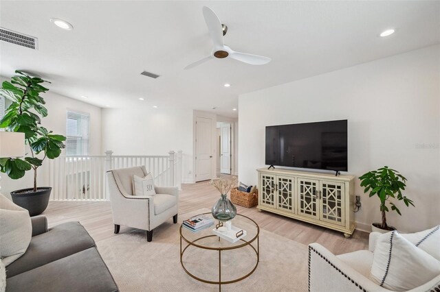 32490 Tree Of Life Ave, Wesley Chapel, FL 33543 - living area featuring a ceiling fan, wood finished floors, and recessed lighting