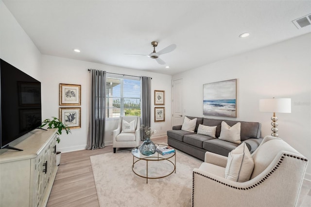 32490 Tree Of Life Ave, Wesley Chapel, FL 33543 - living room featuring light wood-style flooring, baseboards, a ceiling fan, and recessed lighting