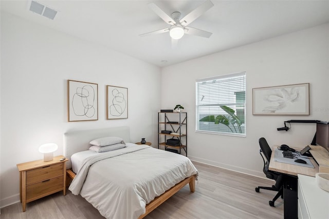32490 Tree Of Life Ave, Wesley Chapel, FL 33543 - bedroom featuring light wood finished floors, an office area, baseboards, and ceiling fan