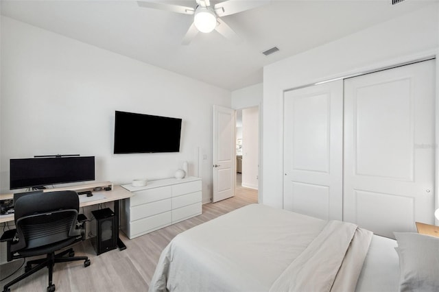 32490 Tree Of Life Ave, Wesley Chapel, FL 33543 - bedroom with light wood-type flooring, an office area, a closet, and ceiling fan