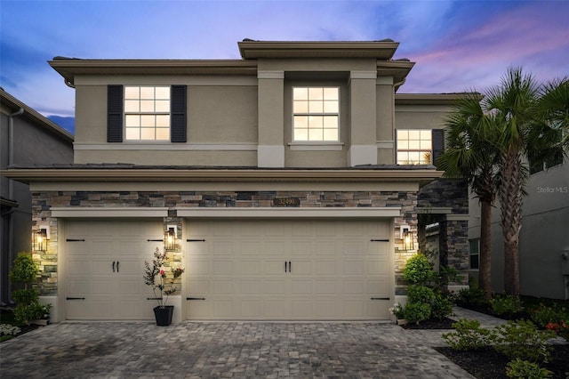 32490 Tree Of Life Ave, Wesley Chapel, FL 33543 - view of front of home with a garage, stucco siding, and driveway