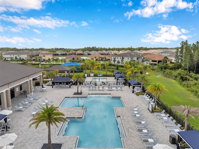 32490 Tree Of Life Ave, Wesley Chapel, FL 33543 - community pool featuring a residential view and a patio