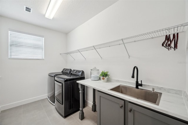 32490 Tree Of Life Ave, Wesley Chapel, FL 33543 - laundry room featuring cabinet space, washing machine and dryer, and a textured ceiling