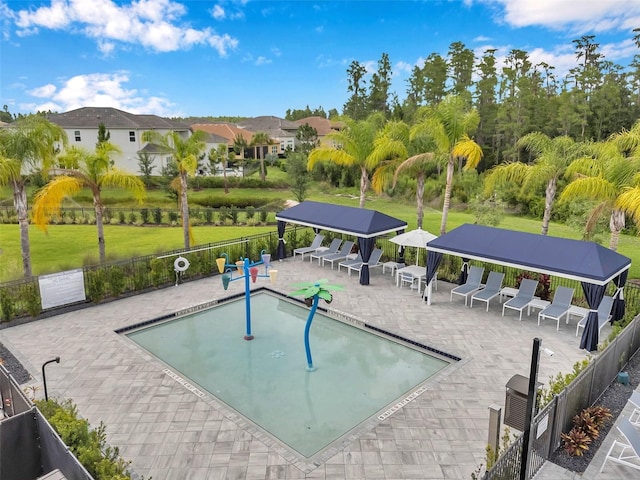 32490 Tree Of Life Ave, Wesley Chapel, FL 33543 - community pool with a patio