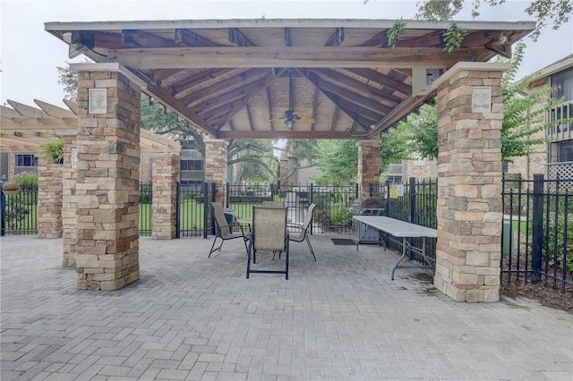 2500 Winding Creek Blvd Unit G307, Clearwater, FL 33761 - view of patio / terrace featuring a gazebo, a ceiling fan, and outdoor dining area