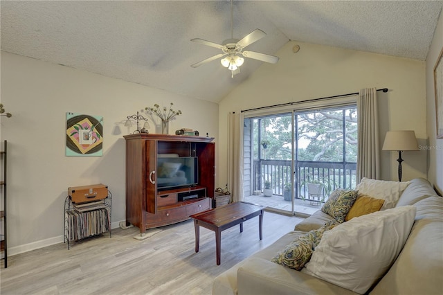 2500 Winding Creek Blvd Unit G307, Clearwater, FL 33761 - living area featuring ceiling fan, light wood-type flooring, a textured ceiling, high vaulted ceiling, and baseboards