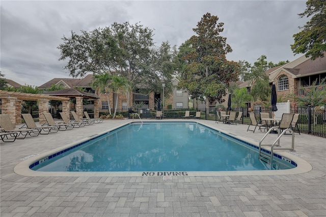 2500 Winding Creek Blvd Unit G307, Clearwater, FL 33761 - community pool featuring a patio and a pergola