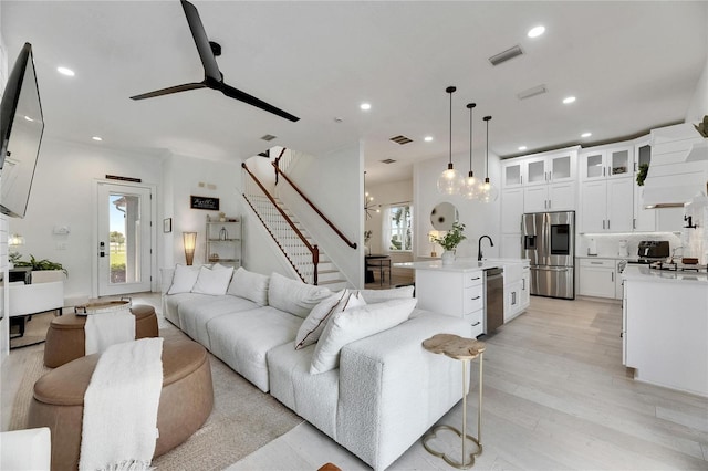 6512 Simone Shores Cir, Apollo Beach, FL 33572 - living room featuring stairs, a ceiling fan, light wood finished floors, and recessed lighting