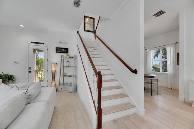 6512 Simone Shores Cir, Apollo Beach, FL 33572 - stairs with healthy amount of natural light, wood finished floors, baseboards, ornamental molding, and recessed lighting