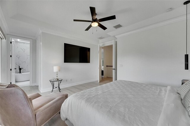6512 Simone Shores Cir, Apollo Beach, FL 33572 - bedroom featuring ornamental molding, connected bathroom, light wood finished floors, a ceiling fan, and baseboards