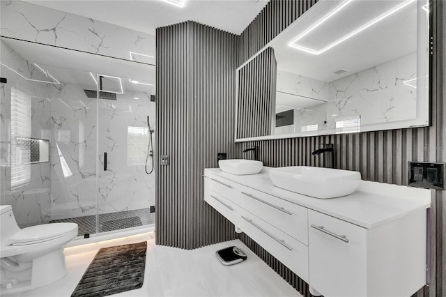 6512 Simone Shores Cir, Apollo Beach, FL 33572 - full bath with toilet, a marble finish shower, double vanity, and marble finish floors