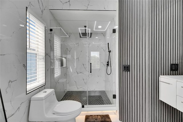 6512 Simone Shores Cir, Apollo Beach, FL 33572 - full bathroom featuring toilet, a marble finish shower, healthy amount of natural light, and vanity