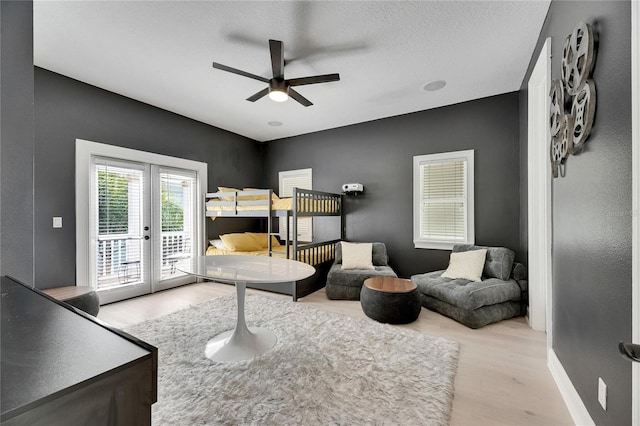 6512 Simone Shores Cir, Apollo Beach, FL 33572 - bedroom with wood finished floors, access to outside, french doors, baseboards, and ceiling fan