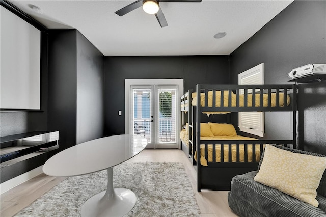 6512 Simone Shores Cir, Apollo Beach, FL 33572 - bedroom with access to outside, wood finished floors, baseboards, a ceiling fan, and french doors