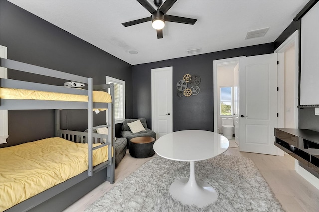 6512 Simone Shores Cir, Apollo Beach, FL 33572 - bedroom with wood finished floors and ceiling fan
