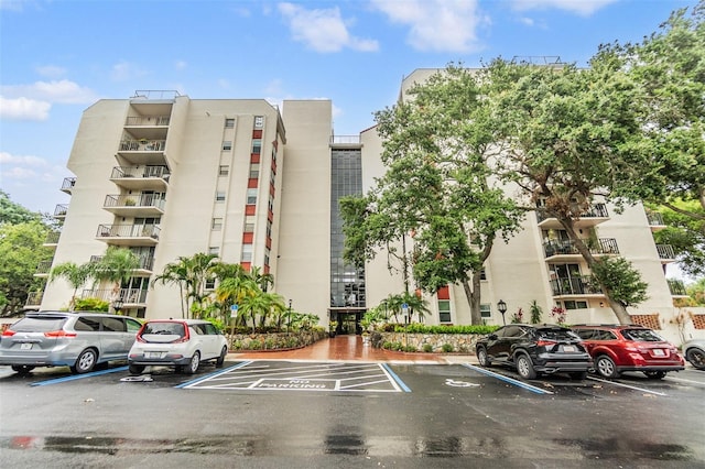 2699 Seville Blvd Unit 207, Clearwater, FL 33764 - view of apartment building / complex with uncovered parking