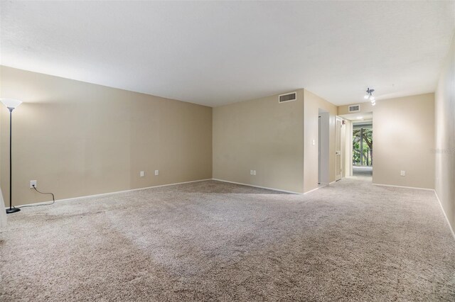2699 Seville Blvd Unit 207, Clearwater, FL 33764 - carpeted spare room with baseboards
