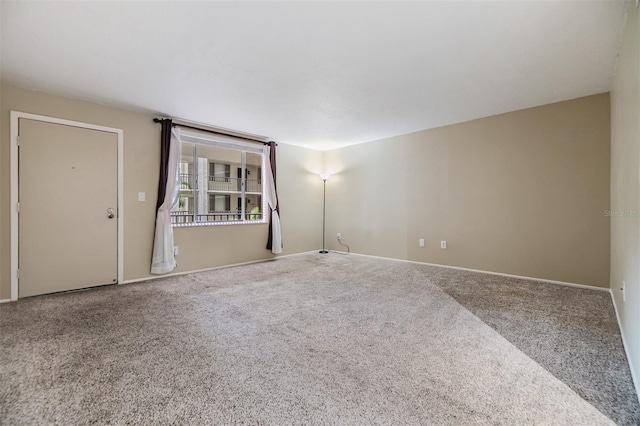 2699 Seville Blvd Unit 207, Clearwater, FL 33764 - carpeted empty room featuring baseboards