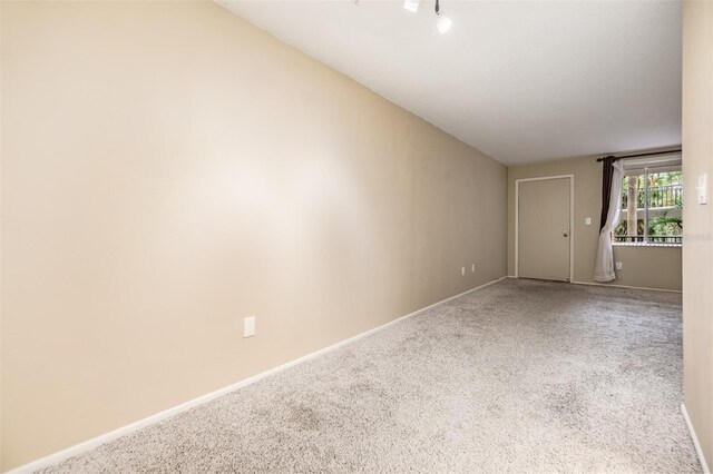 2699 Seville Blvd Unit 207, Clearwater, FL 33764 - empty room featuring carpet floors and baseboards