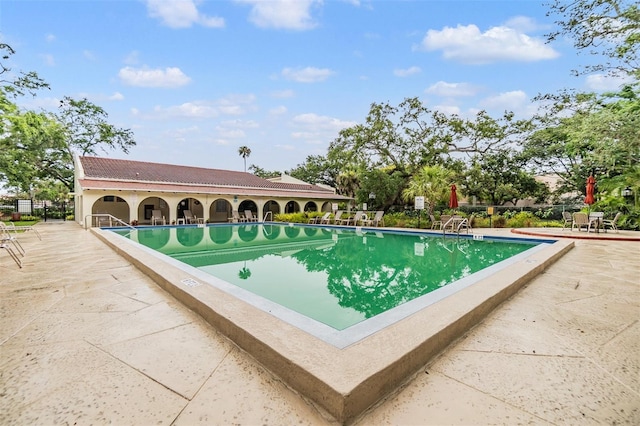 2699 Seville Blvd Unit 207, Clearwater, FL 33764 - community pool featuring a patio