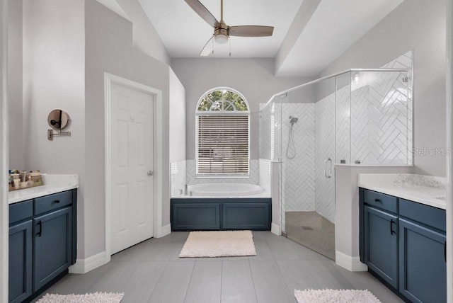 15309 Palomapark Ln, Lithia, FL 33547 - bathroom with a bath, a shower stall, a ceiling fan, lofted ceiling, and tile patterned flooring