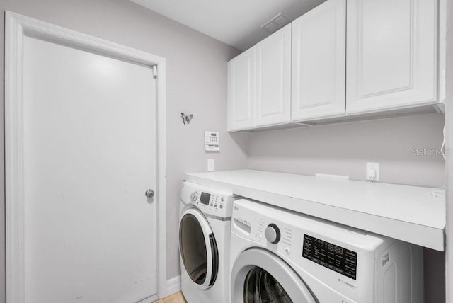 15309 Palomapark Ln, Lithia, FL 33547 - laundry area featuring cabinet space, independent washer and dryer, and baseboards
