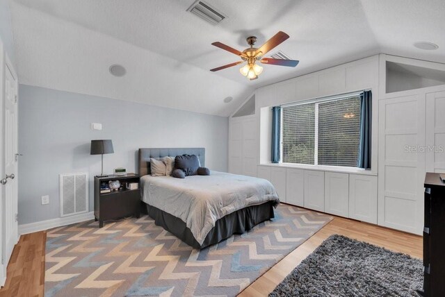 15309 Palomapark Ln, Lithia, FL 33547 - bedroom with lofted ceiling, light wood finished floors, baseboards, and a ceiling fan
