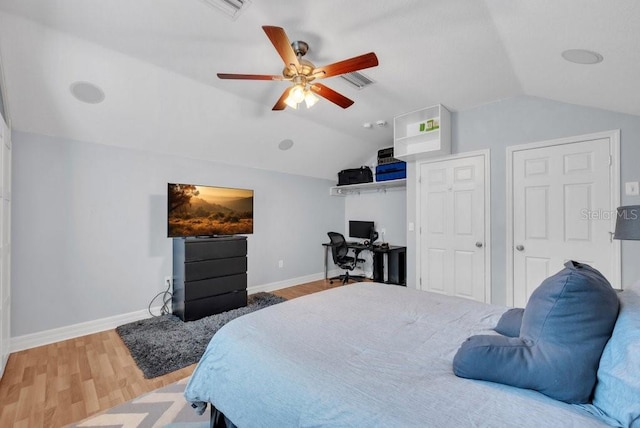 15309 Palomapark Ln, Lithia, FL 33547 - bedroom with lofted ceiling, wood finished floors, baseboards, a desk, and ceiling fan