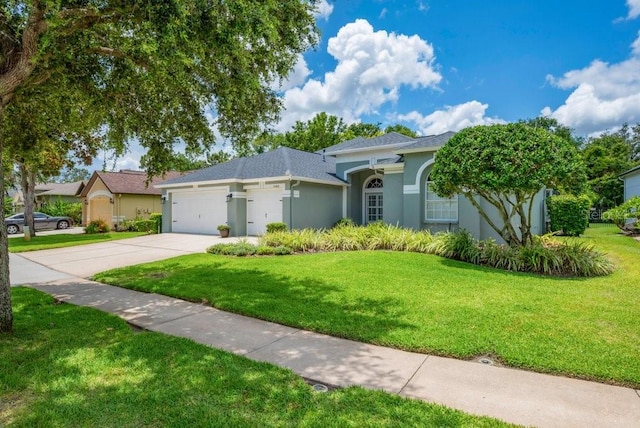 15309 Palomapark Ln, Lithia, FL 33547 - view of front of house with driveway, an attached garage, a front lawn, and stucco siding