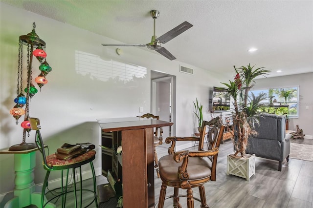 5728 14th Ave N Unit 101B, Saint Petersburg, FL 33710 - bar with wood finished floors, a ceiling fan, recessed lighting, and a textured ceiling