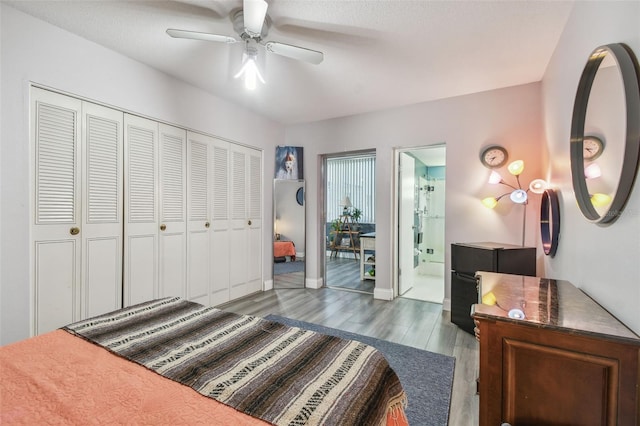 5728 14th Ave N Unit 101B, Saint Petersburg, FL 33710 - bedroom with wood finished floors, baseboards, a closet, ensuite bath, and a ceiling fan