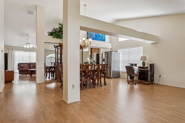 11638 Branch Mooring Dr, Tampa, FL 33635 - dining space with light wood-style flooring, a chandelier, a desk, a ceiling fan, and baseboards