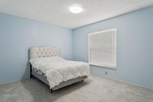 11638 Branch Mooring Dr, Tampa, FL 33635 - bedroom with carpet flooring, a textured ceiling, and baseboards