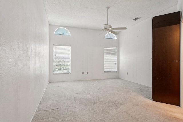 11638 Branch Mooring Dr, Tampa, FL 33635 - carpeted empty room with a textured ceiling and a ceiling fan