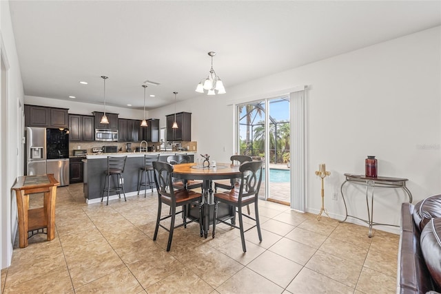 12244 Fairlawn Dr, Riverview, FL 33579 - dining space with a chandelier, recessed lighting, and light tile patterned flooring