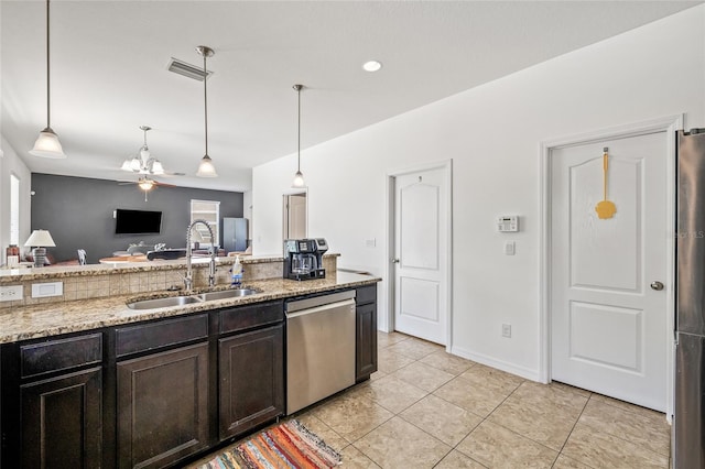 12244 Fairlawn Dr, Riverview, FL 33579 - kitchen with stainless steel dishwasher, open floor plan, decorative light fixtures, and light tile patterned floors