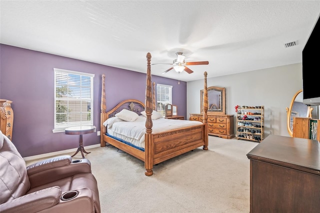 12244 Fairlawn Dr, Riverview, FL 33579 - bedroom with multiple windows, light colored carpet, and a ceiling fan