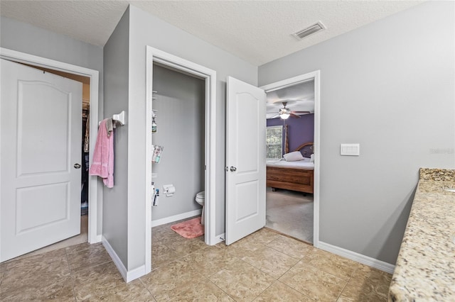 12244 Fairlawn Dr, Riverview, FL 33579 - full bathroom featuring ensuite bath, vanity, a textured ceiling, tile patterned floors, and ceiling fan