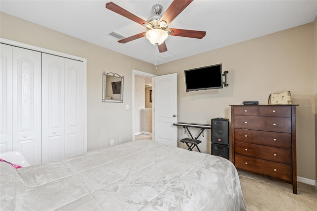 12244 Fairlawn Dr, Riverview, FL 33579 - bedroom with a closet, light carpet, and a ceiling fan